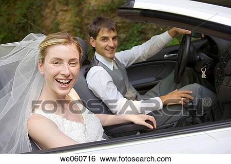 Stock Photograph - Bridal couple in a convertible. Gipuzkoa, Euskadi.. Fotosearch