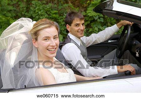 Bridal couple in a convertible. Gipuzkoa, Euskadi. View Large Photo Image Stock Photography - Bridal couple in a convertible. Gipuzkoa, Euskadi.. Fotosearch