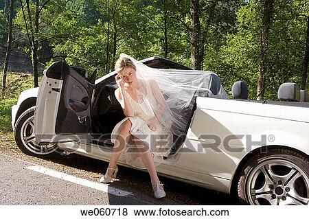 Bride in a convertible. Gipuzkoa, Euskadi. View Large Photo Image Stock Photo - Bride in a convertible. Gipuzkoa, Euskadi.. Fotosearch
