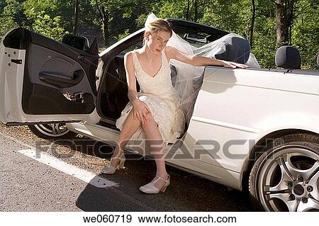 Bride in a convertible. Gipuzkoa, Euskadi. View Large Photo Image Stock Photo - Bride in a convertible. Gipuzkoa, Euskadi.. Fotosearch