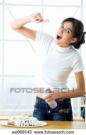 Stock Image - brunette, cake, calorie. Fotosearch