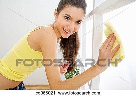 Stock Image - brunette, cleaning, clean, at-home. Fotosearch