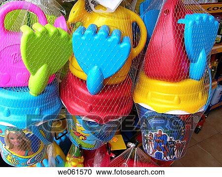 Buckets, shovels and rackets for sale View Large Photo Image Stock Image - Buckets, shovels and rackets for sale. Fotosearch