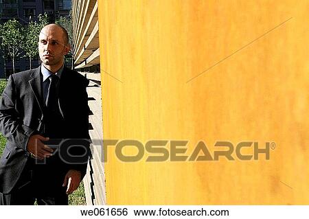 Stock Photograph - building, businesspeople, businessman, business, absorbed. Fotosearch