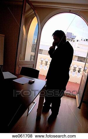 Stock Photo - business, businessman, businesspeople, calling, cell phone. Fotosearch
