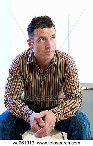 Stock Image - business, businesspeople, businessman, absorbed. Fotosearch