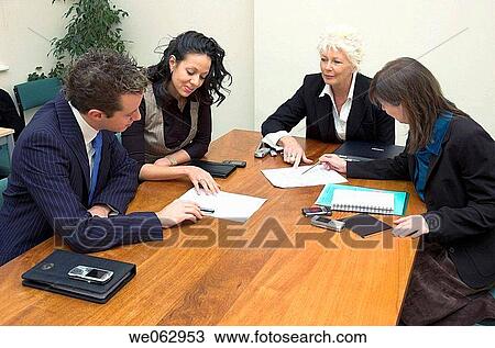 Business team in a meeting. View Large Photo Image Stock Image - Business team in a meeting.. Fotosearch