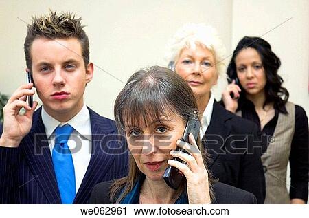 Business team using mobile phones. View Large Photo Image Stock Image - Business team using mobile phones.. Fotosearch