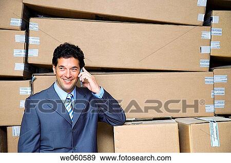 Stock Photo - businessman, businesspeople, cell phone. Fotosearch