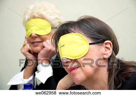 Businesswomen grab a power nap. View Large Photo Image Stock Photo - Businesswomen grab a power nap.. Fotosearch