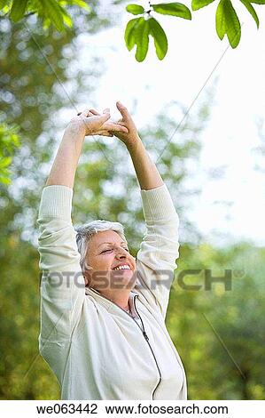 calm, chilling out, Arms raised View Large Photo Image Stock Image - calm, chilling out, Arms raised. Fotosearch