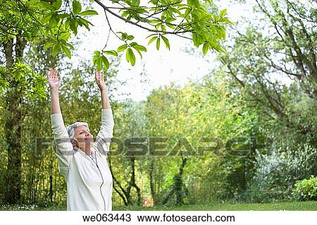calm, chilling out, Arms raised View Large Photo Image Stock Image - calm, chilling out, Arms raised. Fotosearch