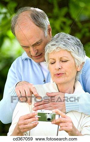 camera, contemporary, couple View Large Photo Image Stock Photo - camera, contemporary, couple. Fotosearch