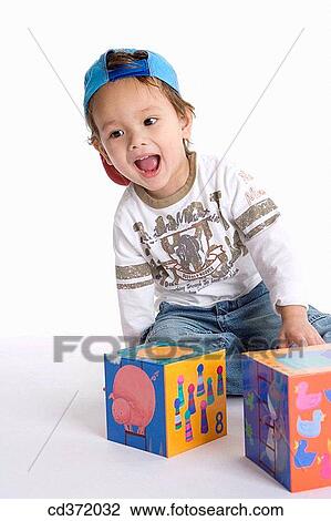 Stock Image - cap, baby, boy, block, black hair, 3-4 years. Fotosearch