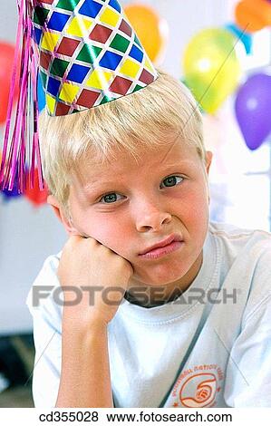 Stock Photo - cap, blond, boy, boredom, bored, angry. Fotosearch