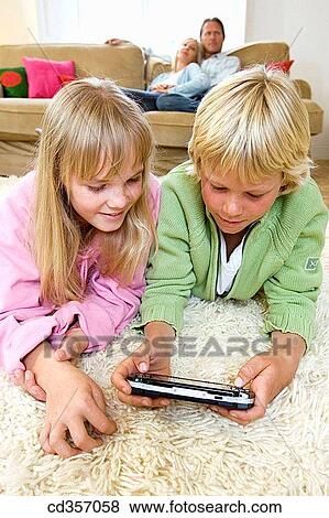 carpet, amusement, brother, boy, at-home, addiction View Large Photo Image Stock Photo - carpet, amusement, brother, boy, at-home, addiction. Fotosearch