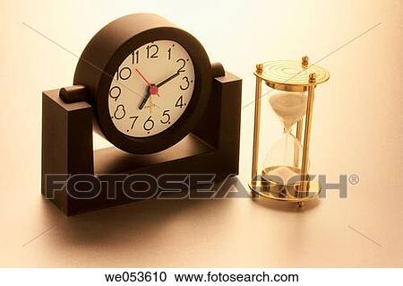 Clock and hourglass View Large Photo Image Stock Image - Clock and hourglass. Fotosearch