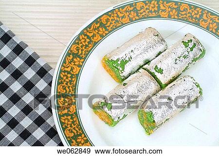 Close-up of Kaju Roll kept on a plate. View Large Photo Image Stock Photo - Close-up of Kaju Roll kept on a plate.. Fotosearch