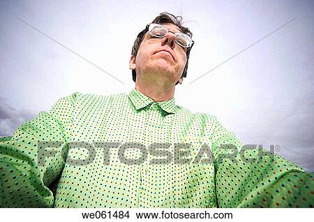 Close_up of a man wearing glasses View Large Photo Image Picture - Close_up of a man wearing glasses. Fotosearch