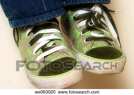 Close_up of a woman's sneakers View Large Photo Image Stock Image - Close_up of a woman's sneakers. Fotosearch