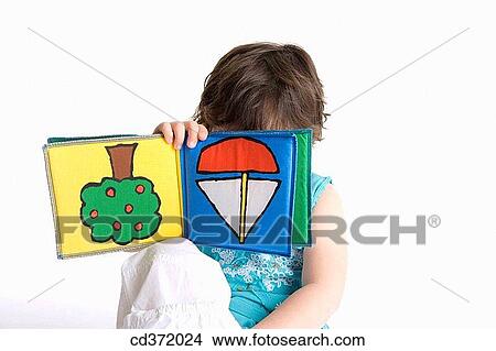 Picture - Cloth book, baby, childhood, child, brunette, 3-4 years. Fotosearch