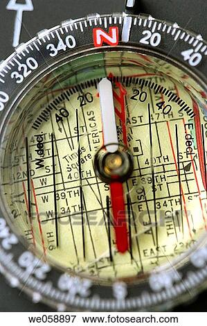 Compass on top of a nyc map of Times Square View Large Photo Image Stock Photo - Compass on top of a nyc map of Times Square. Fotosearch