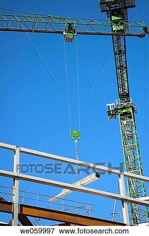Construction crane on site at large scale urban regeneration project. View Large Photo Image Stock Photo - Construction crane on site at large scale urban regeneration project.. Fotosearch
