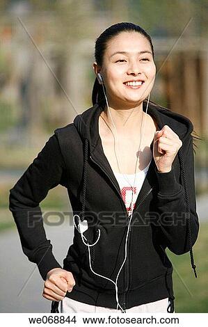 contemporary, earphone, day, Asian View Large Photo Image Picture - contemporary, earphone, day, Asian. Fotosearch