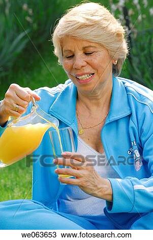 Stock Image - day, drink, Facial expression, Female. Fotosearch