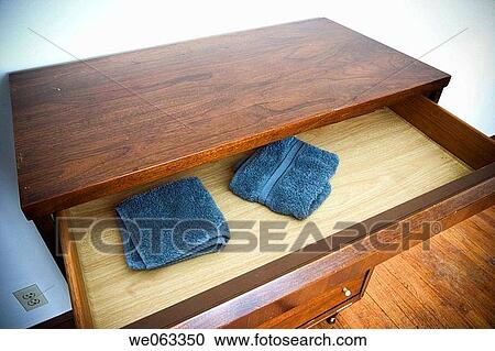Dresser with blue washcloths in its open drawer. View Large Photo Image Stock Image - Dresser with blue washcloths in its open drawer.. Fotosearch