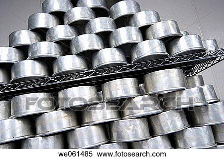 Empty cake pans stacked on a shelf View Large Photo Image Stock Photography - Empty cake pans stacked on a shelf. Fotosearch