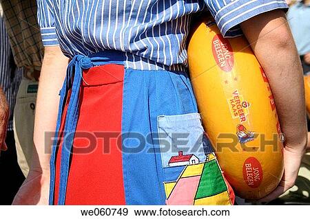 Farmhand with cheese roll on cheese market, Kaasmarkt, Gouda, Holland, Netherlands View Large Photo Image Stock Photo - Farmhand with cheese roll on cheese market, Kaasmarkt, Gouda, Holland, Netherlands. Fotosearch