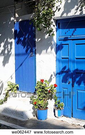 Flowerpots and blue doors, Mirtos (Myrtos), Southern Crete, Greece View Large Photo Image Stock Photo - Flowerpots and blue doors, Mirtos (Myrtos), Southern Crete, Greece. Fotosearch