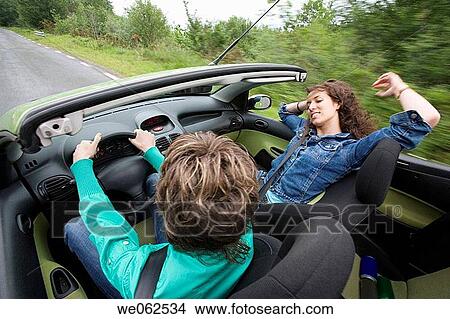 Friends in convertible car, Gipuzkoa, Euskadi. Spain. View Large Photo Image Picture - Friends in convertible car, Gipuzkoa, Euskadi. Spain.. Fotosearch