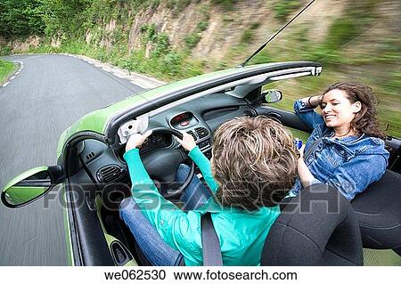 Stock Image - Friends in convertible car, Gipuzkoa, Euskadi. Spain.. Fotosearch