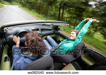 Stock Image - Friends in convertible car, Gipuzkoa, Euskadi. Spain.. Fotosearch