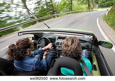 Stock Image - Friends in convertible car, Gipuzkoa, Euskadi. Spain.. Fotosearch