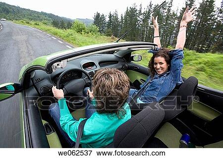 Stock Photo - Friends in convertible car, Gipuzkoa, Euskadi. Spain.. Fotosearch