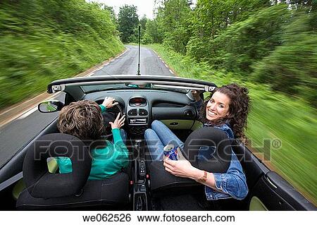 Friends in convertible car, Gipuzkoa, Euskadi. Spain. View Large Photo Image Stock Photograph - Friends in convertible car, Gipuzkoa, Euskadi. Spain.. Fotosearch