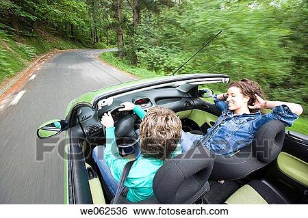 Friends in convertible car, Gipuzkoa, Euskadi. Spain. View Large Photo Image Stock Photograph - Friends in convertible car, Gipuzkoa, Euskadi. Spain.. Fotosearch