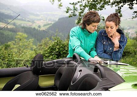 Stock Image - Friends in convertible car. Mirador de Udana, O±ate. Gipuzkoa, Euskadi. Spain.. Fotosearch