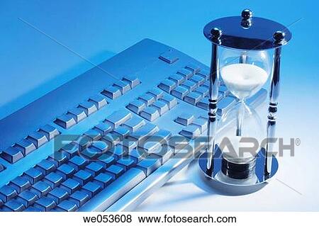 Hourglass and keyboard View Large Photo Image Stock Photo - Hourglass and keyboard. Fotosearch
