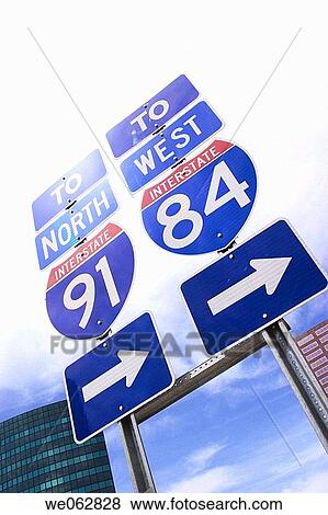Stock Photo - ? Interstate 91 and 84? traffic signs and arrows.. Fotosearch