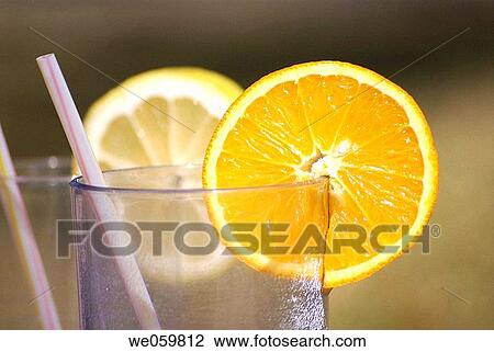 Lemon and orange slices on glasses. View Large Photo Image Stock Image - Lemon and orange slices on glasses.. Fotosearch
