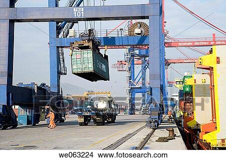 Loading cargo containers in ship, Port of Bilbao, Santurtzi. Biscay, Euskadi, Spain View Large Photo Image Picture - Loading cargo containers in ship, Port of Bilbao, Santurtzi. Biscay, Euskadi, Spain. Fotosearch
