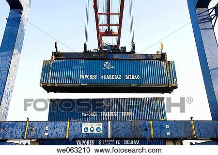 Loading cargo containers in ship, Port of Bilbao, Santurtzi. Biscay, Euskadi, Spain View Large Photo Image Stock Image - Loading cargo containers in ship, Port of Bilbao, Santurtzi. Biscay, Euskadi, Spain. Fotosearch