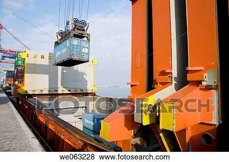 Loading cargo containers in ship, Port of Bilbao, Santurtzi. Biscay, Euskadi, Spain View Large Photo Image Stock Photo - Loading cargo containers in ship, Port of Bilbao, Santurtzi. Biscay, Euskadi, Spain. Fotosearch