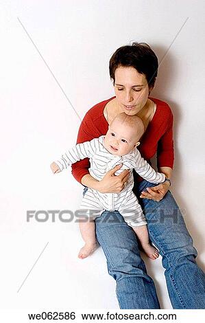 Stock Photograph - Mother and six-month-old baby. Fotosearch