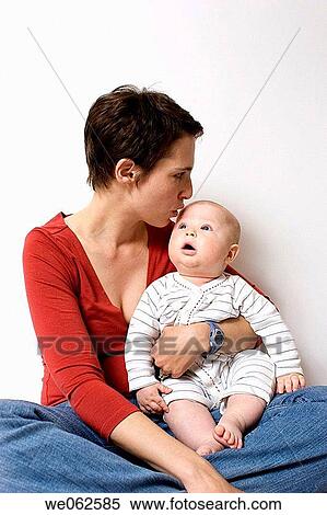 Stock Photography - Mother and six-month-old baby. Fotosearch