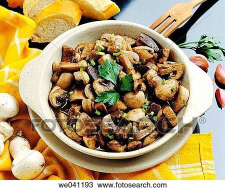 Stock Image - Mushrooms in garlic sauce. Fotosearch